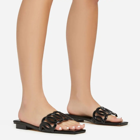ALL-THE-WAY-UP CUT OUT STRAP DETAIL SQUARE TOE FLAT SLIDER SANDAL IN BLACK PATENT
