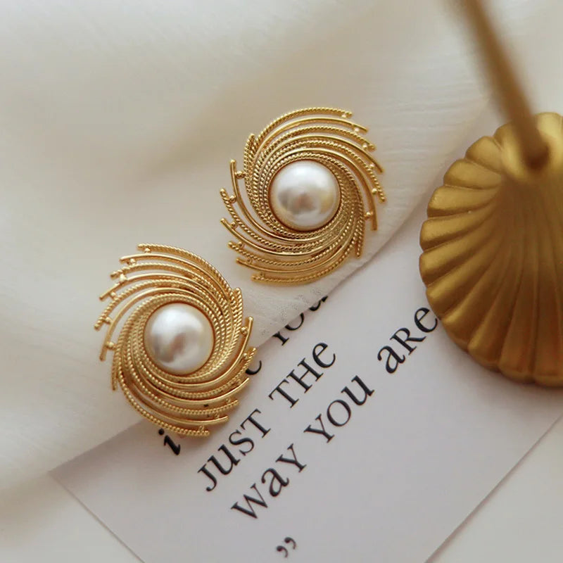 Exagerated spiral pearl gold stud earrings SJP